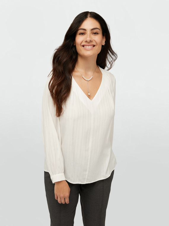 Blouse with pearl necklace