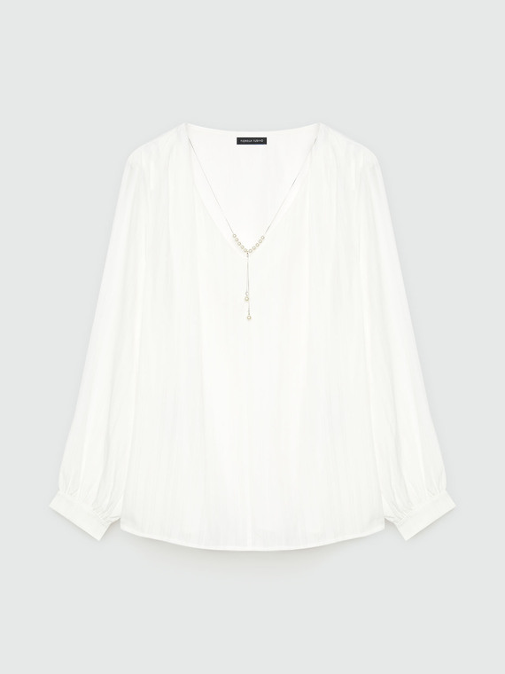 Blouse with pearl necklace