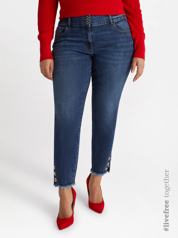 Jeans skinny con occhielli decorativi