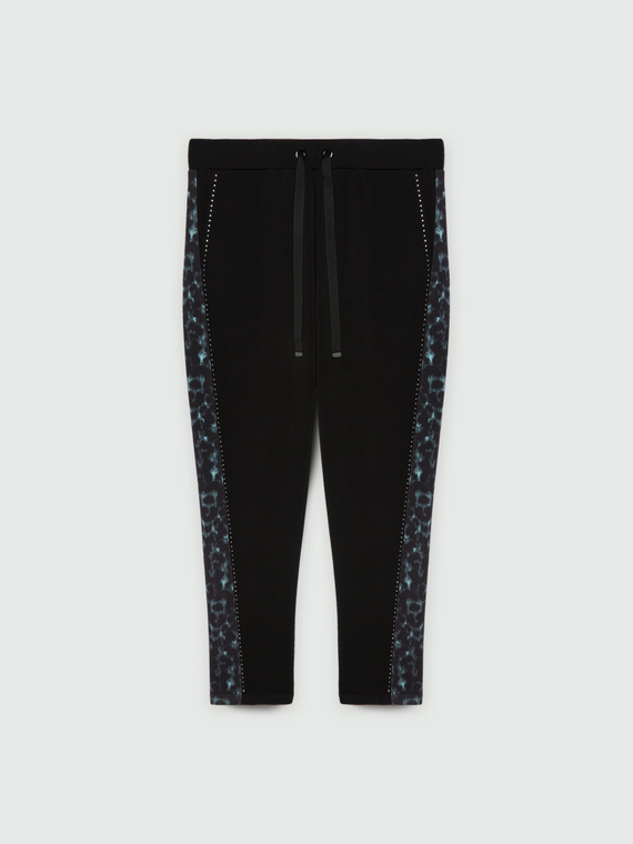 Pantaloni joggers con bordo animalier e punti luce