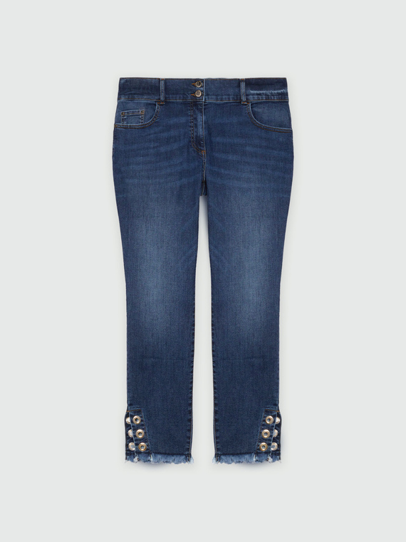 Jeans skinny con occhielli decorativi