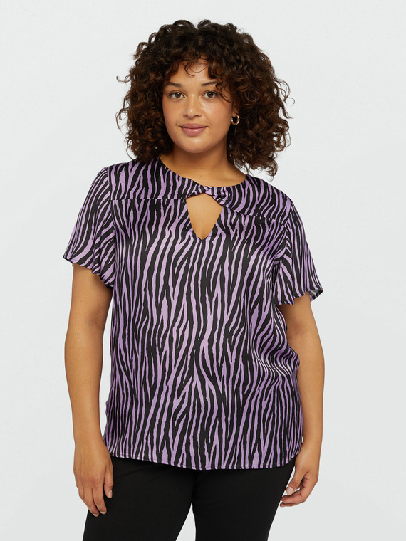 Blusa animalier con nodo