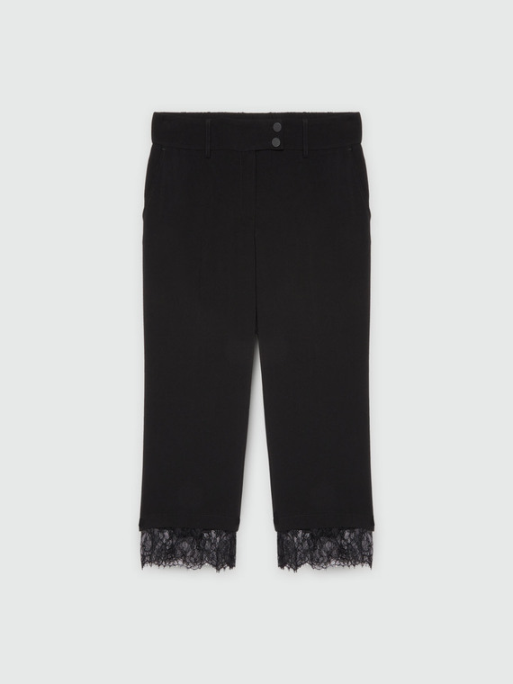 Cropped trousers with lace on the hem